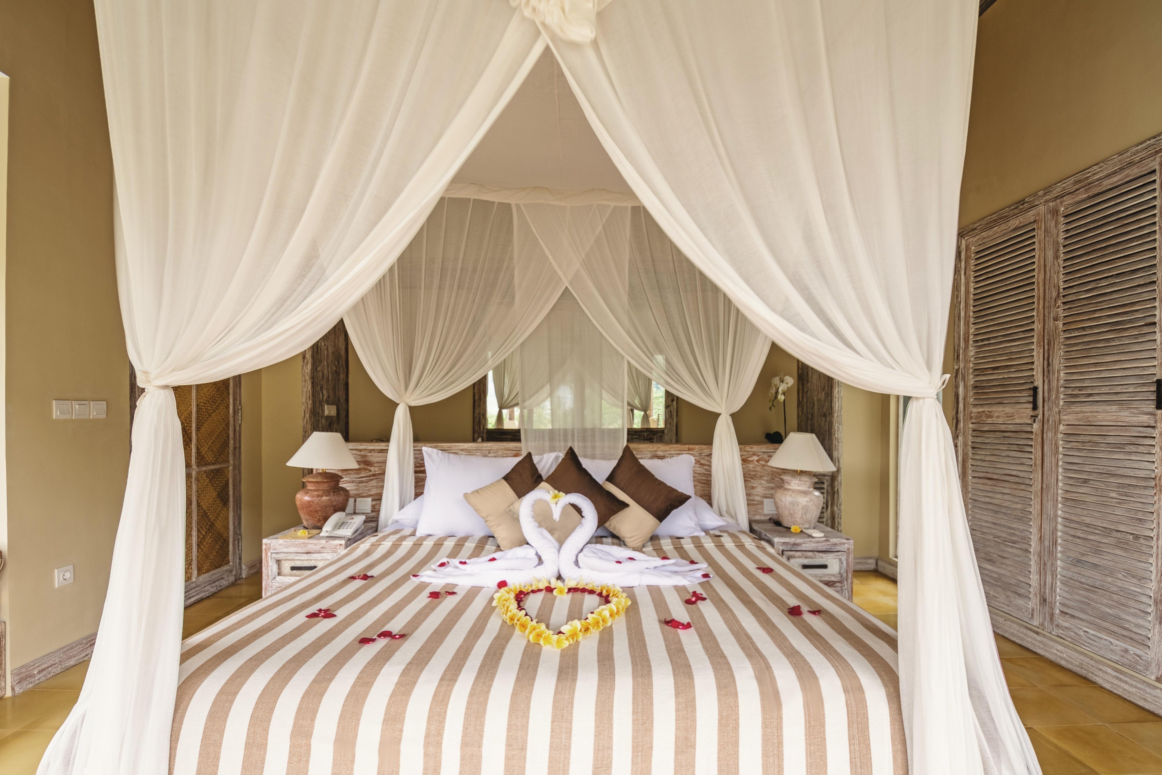 Wapa Di Ume Sidemen Hotell Exteriör bild A bed with a mosquito net